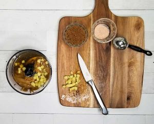 picture of cut up ginger next to food processor