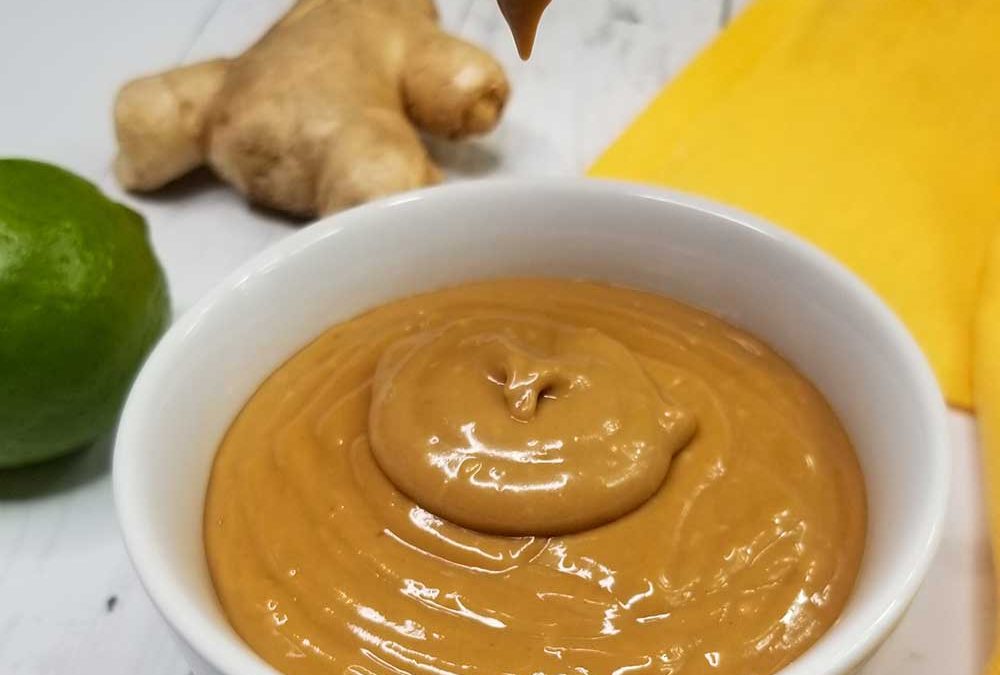 picture of pouring nut free thai peanut sauce into bowl