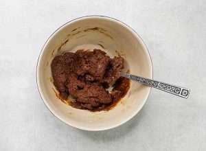 fully mixed molasses ginger cookie dough in bowl