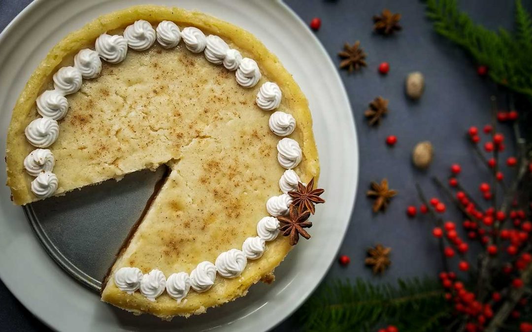 top down photo of eggnog cheesecake with one piece missing