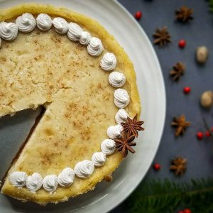 top down photo of eggnog cheesecake with one piece missing