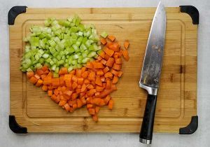 picture of chopped up carrots and celery on cutting board