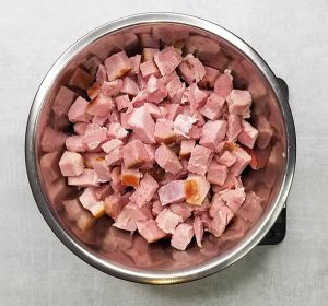 photo of chopped up ham on food scale in large bowl