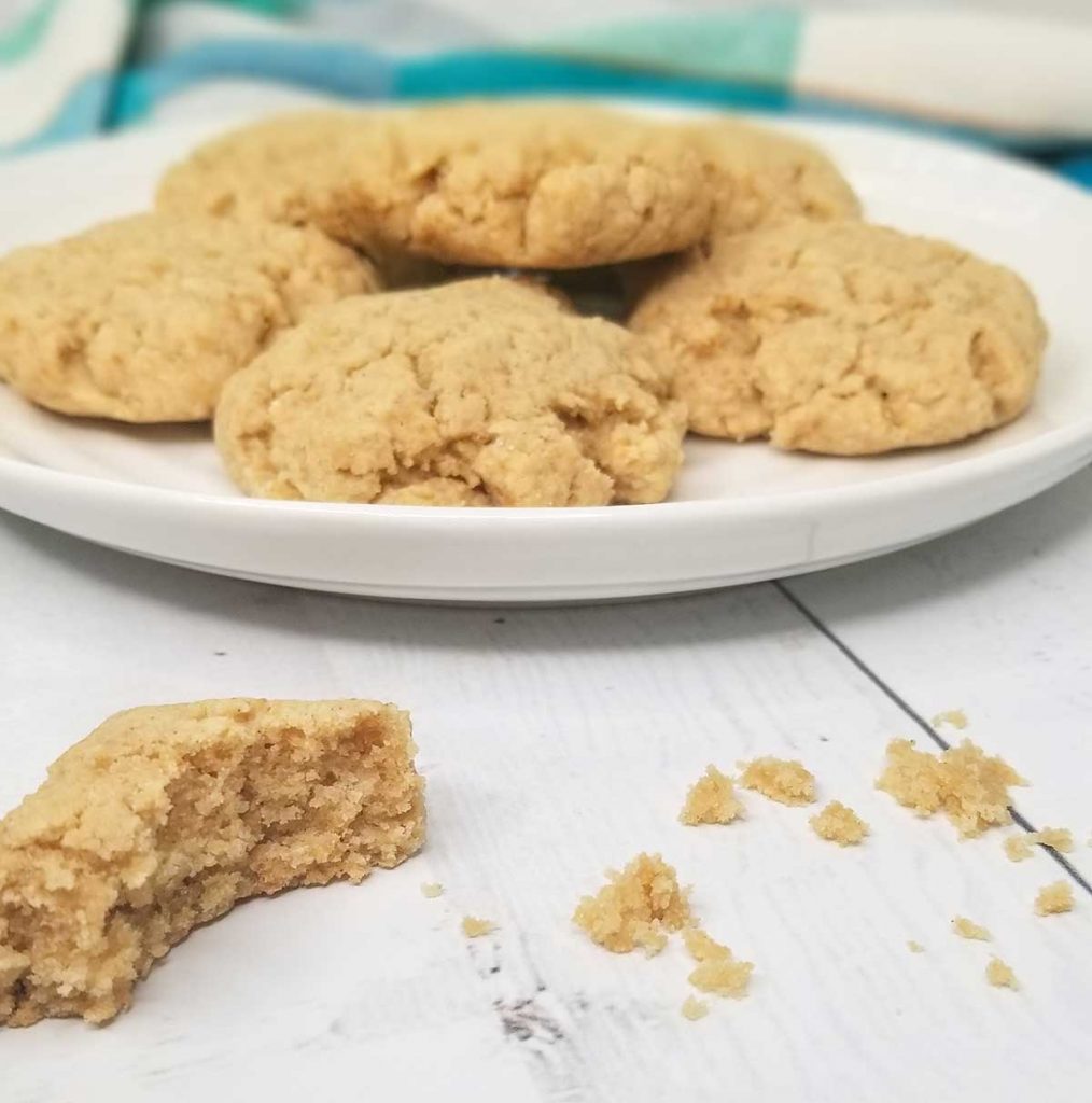 image of plate of cookies with one cookie partially eaten