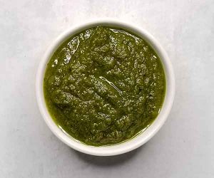 Overhead shot of blended pesto in small bowl