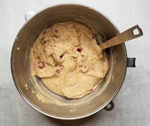 Muffin batter with raspberries gently folded in