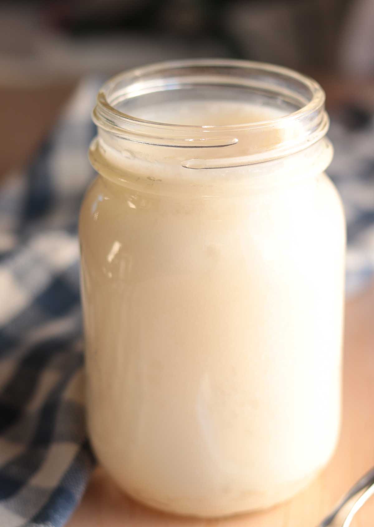 Close up view of beef tallow in mason jar