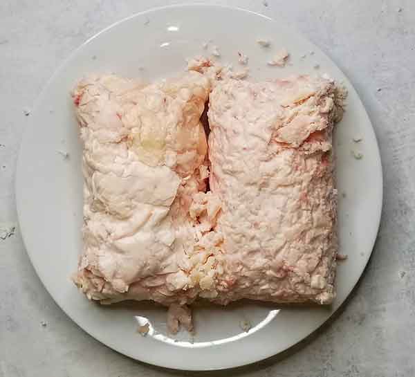 Beef suet fat trimmings sitting on a plate.