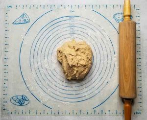 Ball of dough on floured surface