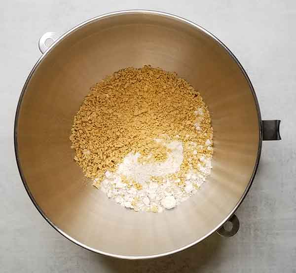 Dry cookie ingredients in metal mixing bowl