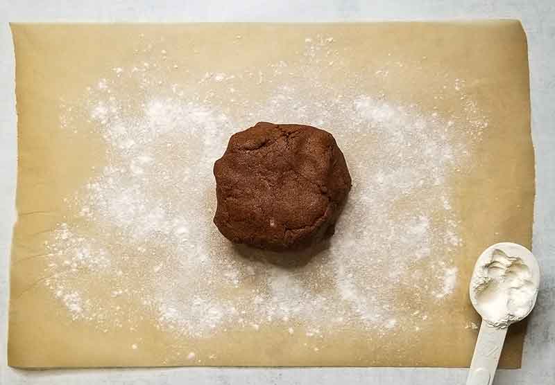 Dough ball placed onto parchment paper dusted with cassava flour