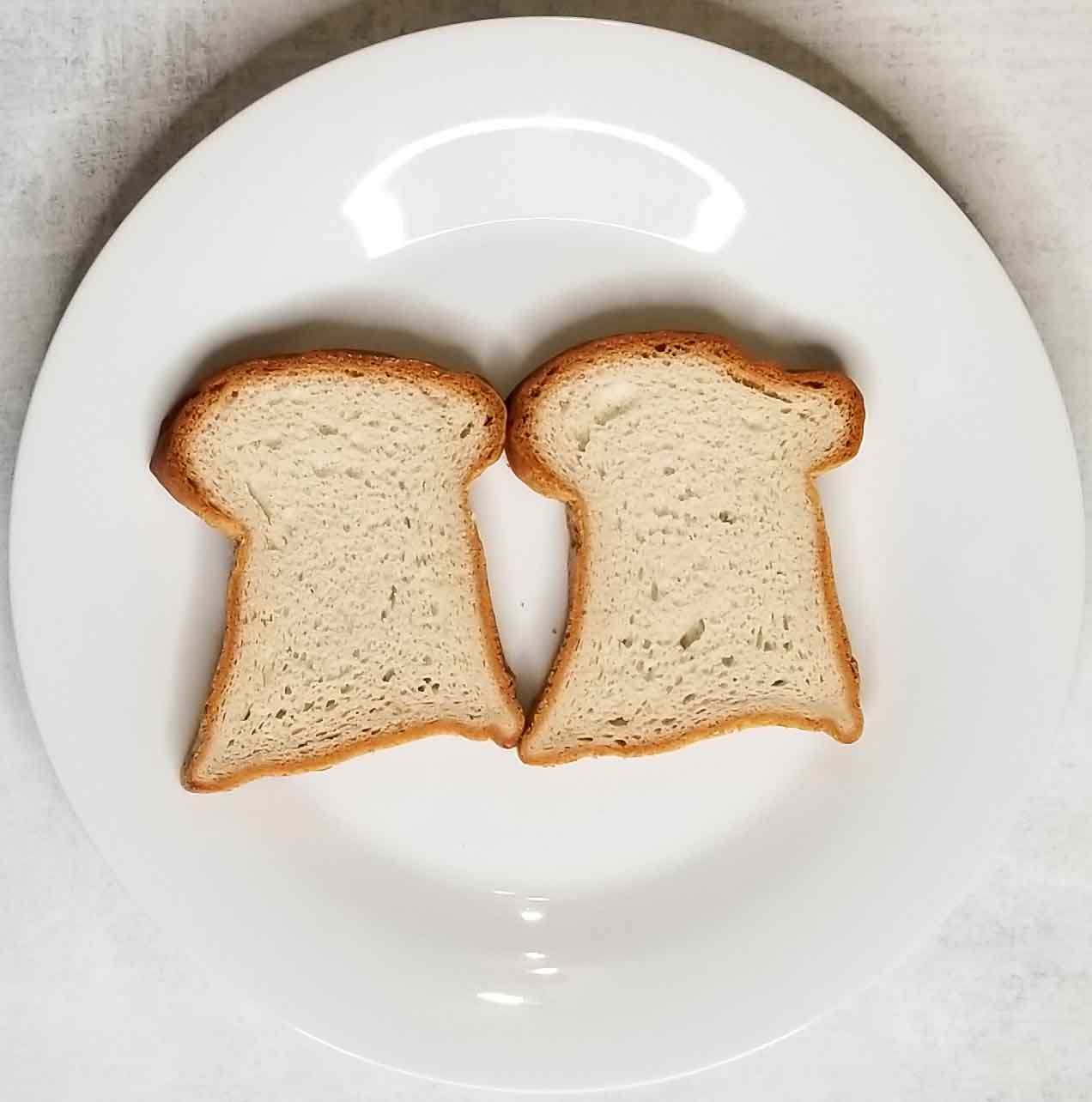 two pieces of gluten free bread on plate