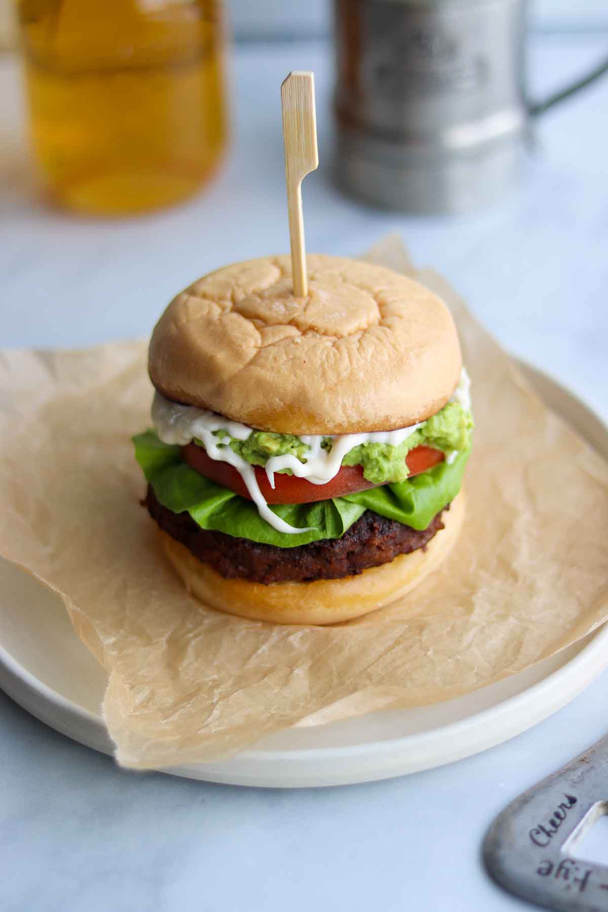 Black bean burger done up with toppings on a bun 