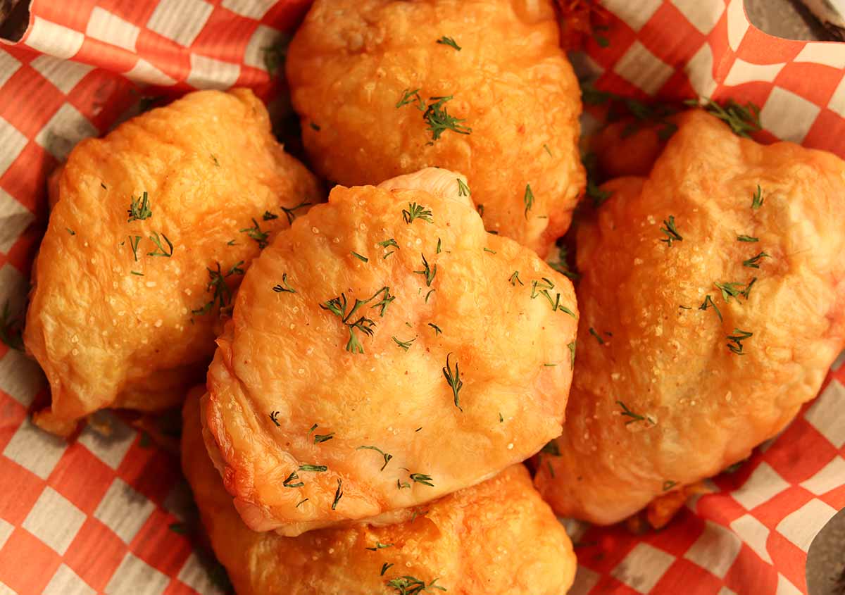 Close up view of crispy oven baked chicken thighs