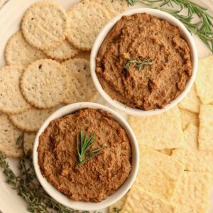 Beef liver pate surrounded by a variety of crackers