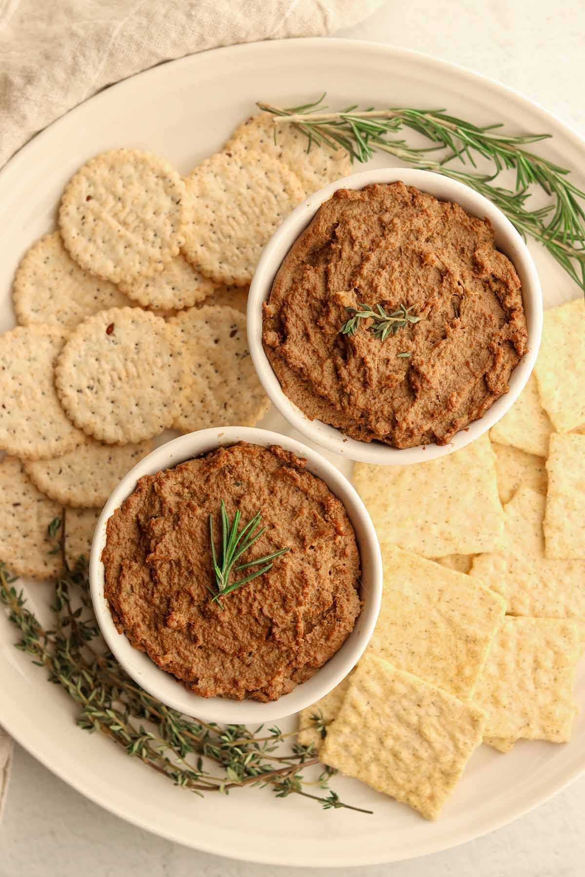 Beef liver pate surrounded by a variety of crackers