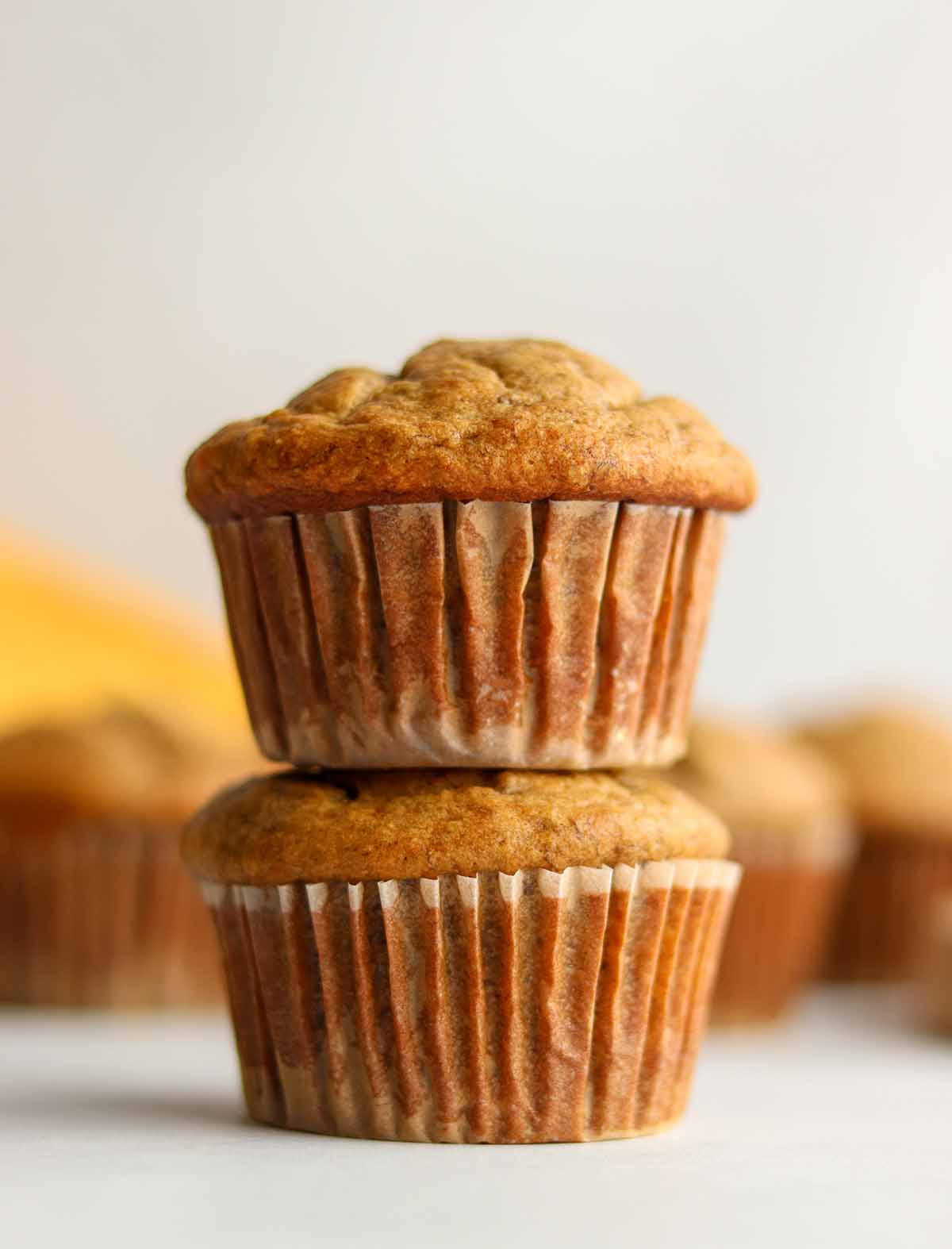 Oat flour muffins stacked on top of each other