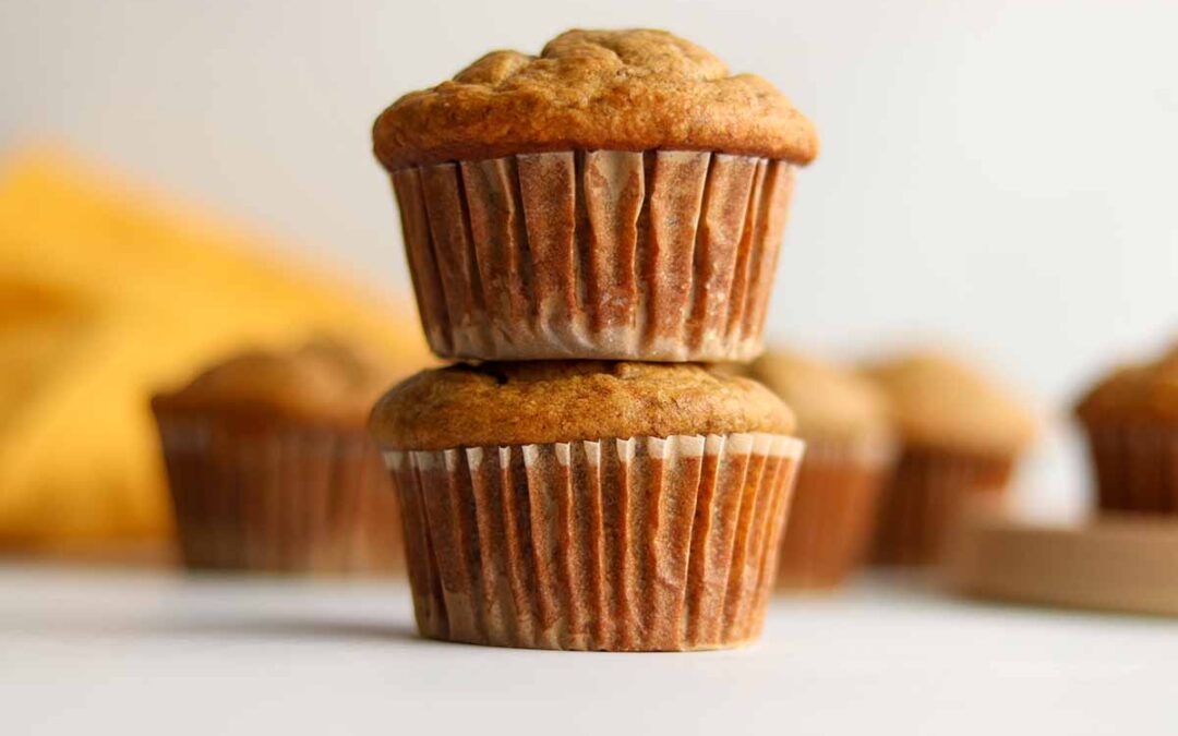 Two oat flour muffins stacked on top of each other