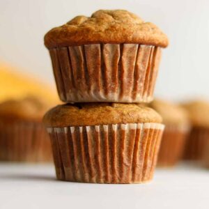 Two oat flour muffins stacked on top of each other