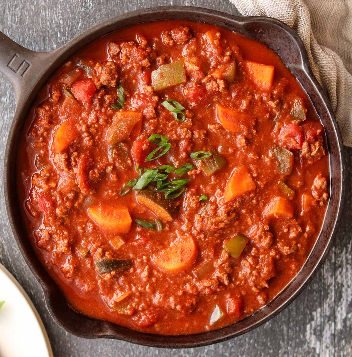 Close up view of paleo chili in a cast iron skillet