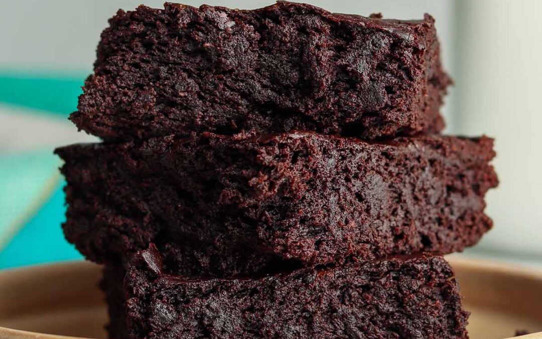 Thick avocado brownies stacked on top of each other