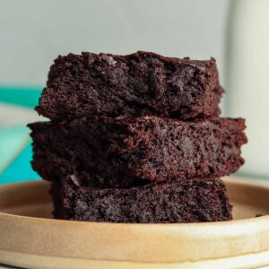 Thick avocado brownies stacked on top of each other